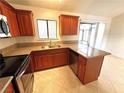 Beautiful kitchen with wood cabinets, granite countertops, and stainless steel appliances at 1208 Winwood St, Las Vegas, NV 89108