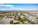 Expansive aerial view of the property showcasing its large lot size, mature trees, and scenic city views at 1410 E Serene Ave, Las Vegas, NV 89123