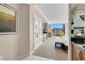 Bright bedroom features a comfortable bed, sitting area, and expansive windows offering city views at 145 E Harmon Ave # 2411, Las Vegas, NV 89109