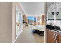 Bright bedroom features a comfortable bed, sitting area, and expansive windows offering city views at 145 E Harmon Ave # 2411, Las Vegas, NV 89109