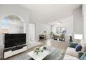 Open-concept living space with large windows, stylish furniture, and a seamless flow to the dining area at 1800 Edmond St # 226, Las Vegas, NV 89146