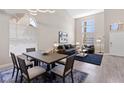 Bright living and dining area with high ceilings, lots of natural light, and an open floor plan at 191 Reed Ln, Henderson, NV 89074