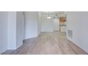Spacious living room with wood flooring and neutral paint, ready for decor and furnishings at 23 E Agate Ave # 207, Las Vegas, NV 89123