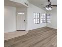 Bright living room with new flooring, vaulted ceiling and a light color scheme, creating a welcoming atmosphere at 2501 Muirfield Ave, Henderson, NV 89074