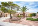 Attractive single-story home with a two car garage, tile roof, mature trees, and desert landscaping at 2737 Tumble Brook Dr, Las Vegas, NV 89134