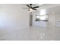 Bright living room featuring an open floor plan and marble flooring at 3115 Wright Ave, North Las Vegas, NV 89030
