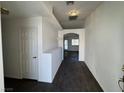 Inviting entryway with dark wood-look floors and freshly painted white walls at 3429 Back Country Dr, North Las Vegas, NV 89031