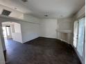 Bright living room featuring modern wood-look flooring and a decorative fireplace at 3429 Back Country Dr, North Las Vegas, NV 89031