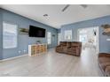 Spacious living room with neutral tile floors and comfortable seating at 3760 Candytuft Ridge Ave, North Las Vegas, NV 89081