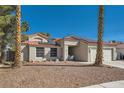 Charming single-story home with a well-maintained exterior, complemented by desert landscaping and a two-car garage at 4212 Herblinda Ln, North Las Vegas, NV 89032