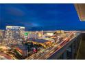 Nighttime view of the illuminated Las Vegas strip from the condo balcony at 4471 Dean Martin Dr # 4308, Las Vegas, NV 89103