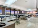 Bright and spacious living room with a glass dining table, comfortable seating, and an amazing city view at 4471 Dean Martin Dr # 4308, Las Vegas, NV 89103
