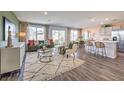 Open-concept living room features modern decor and lots of natural light at 5722 Sunset Sedona St # Lot 7, North Las Vegas, NV 89081