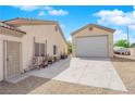 View of an additional garage on the property, separate from the main residence, with a large driveway at 6781 Alpine Brooks Ave, Las Vegas, NV 89130