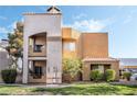 Multi-level condo building with balconies and unique desert architecture at 6857 Tamarus St # 202, Las Vegas, NV 89119