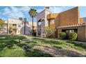 Attractive condo building showcasing colorful architectural design set amongst green lawns at 6857 Tamarus St # 202, Las Vegas, NV 89119