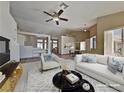 Open-concept living room with vaulted ceilings, stylish furnishings, and an abundance of natural light at 7417 Red Eagle St, Las Vegas, NV 89131