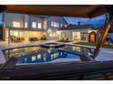 View of the backyard pool, patio, and playset from beneath a shaded swing at 8000 Clock Tower Ct Ct, Las Vegas, NV 89117