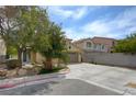 Charming two-story home featuring a well-maintained lawn and desert landscaping, with an attached two-car garage at 1131 Sax Fifth Ave, Henderson, NV 89052