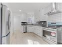 Modern kitchen featuring white cabinets, stainless steel appliances, and updated countertops at 1225 S 15Th St, Las Vegas, NV 89104