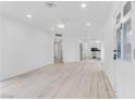 Spacious living room with hardwood floors, recessed lighting, and an open floor plan at 1225 S 15Th St, Las Vegas, NV 89104