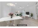Bright and airy living room is virtually staged with modern furniture and decor at 1225 S 15Th St, Las Vegas, NV 89104