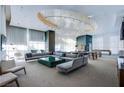 Spacious resident lounge with comfortable seating, stylish decor, and a billiard table for relaxation at 222 Karen Ave # 2401, Las Vegas, NV 89109