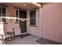 Inviting front porch featuring decorative accents and comfortable seating area at 235 Desert Arroyo Ct, Henderson, NV 89012