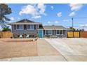 Charming two-story home featuring a manicured lawn, driveway, and serene curb appeal at 2447 Tournament St, Las Vegas, NV 89142