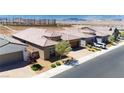 Overhead view showcasing a neighborhood with desert landscaping, tile roofs, and mountain views at 2719 Canvas Sky St, Henderson, NV 89044