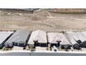 A high-angle view of similar homes in a planned community bordering desert landscape at 2719 Canvas Sky St, Henderson, NV 89044