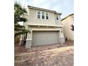 Inviting two-story home showcasing a two-car garage and meticulously paved driveway at 2922 Tranquil Brook Ave, Henderson, NV 89044