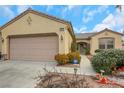 Charming single story home featuring desert landscaping, a tile roof, and an attached two car garage at 2969 Sumter Valley Cir, Henderson, NV 89052