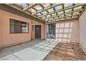 Private courtyard with a lattice-covered patio providing shade and a relaxing outdoor space at 3609 Laguna Del Sol Dr, Las Vegas, NV 89121