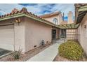 Inviting single-story home entrance featuring a private courtyard and well-maintained desert landscaping at 3609 Laguna Del Sol Dr, Las Vegas, NV 89121