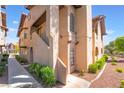 Charming condo exterior with stairs, tile roof, and desert landscaping at 4097 Nook Way # A, Las Vegas, NV 89103