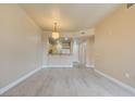Open-concept living space with modern floors, breakfast bar overlooking the kitchen, and inviting natural light at 55 E Agate Ave # 309, Las Vegas, NV 89123