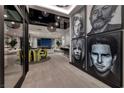 Grand foyer features an open floor plan, high ceilings, striking artwork, and contemporary lighting fixtures at 557 Overlook Rim Dr, Henderson, NV 89012