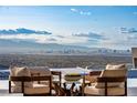 Daytime view of the city skyline from the home's outdoor seating area at 667 Palisade Rim Dr, Henderson, NV 89012