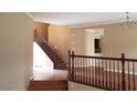 Foyer with hardwood steps and banister leading to the second floor at 7073 Seabirds Pl, North Las Vegas, NV 89084