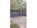 View of the spacious two-car garage and brick-paved driveway at 7342 Tanglewood Park St, Las Vegas, NV 89166
