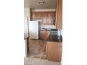 Kitchen featuring light-colored cabinets and appliances at 7342 Tanglewood Park St, Las Vegas, NV 89166