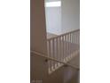 Staircase with white railing and neutral carpet at 7342 Tanglewood Park St, Las Vegas, NV 89166