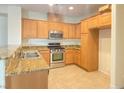 Well-equipped kitchen featuring granite countertops and stainless steel appliances at 8374 Pioneer Way, Las Vegas, NV 89113