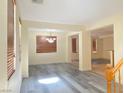 Bright open-plan living area featuring wood-look floors and ample natural light at 8374 Pioneer Way, Las Vegas, NV 89113