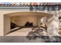 Spacious carport featuring a concrete floor, covered parking, and stucco support columns at 8455 W Sahara Ave # 287, Las Vegas, NV 89117