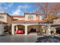 Charming condo complex featuring covered parking, red tile roof, and well-maintained landscaping at 8455 W Sahara Ave # 287, Las Vegas, NV 89117