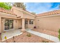 Home exterior features a covered porch with column, desert landscaping, and pathway leading to the front door at 8513 Glenmount Dr, Las Vegas, NV 89134