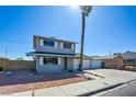 Inviting two-story home with a long driveway, a spacious two car garage, and low maintenance front yard at 125 Sam Jonas Dr, Las Vegas, NV 89145