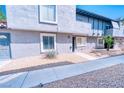 Charming two-story condo features well-maintained landscaping, stucco exterior, and a concrete pathway at 1326 N Jones Blvd, Las Vegas, NV 89108